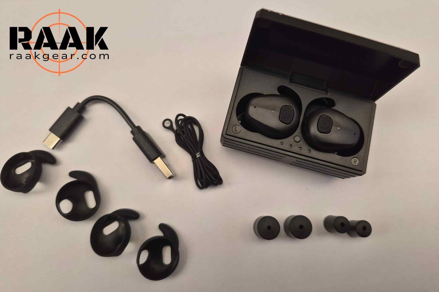 Full BL03 accessory kit — charging case, cable, retention strings, and ear tip sizes