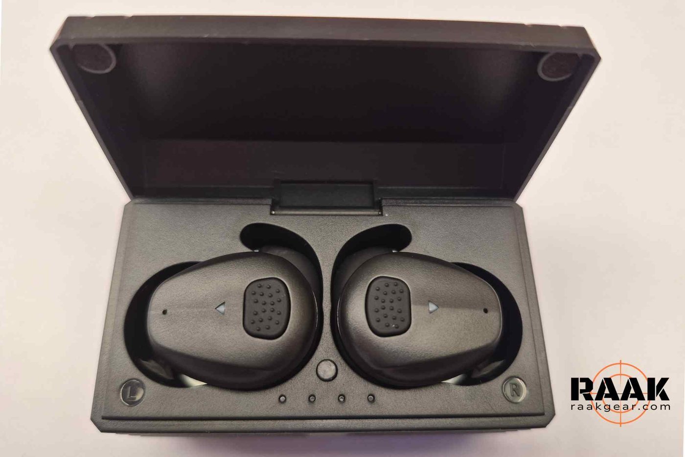 BL03 earbuds in the open charging case